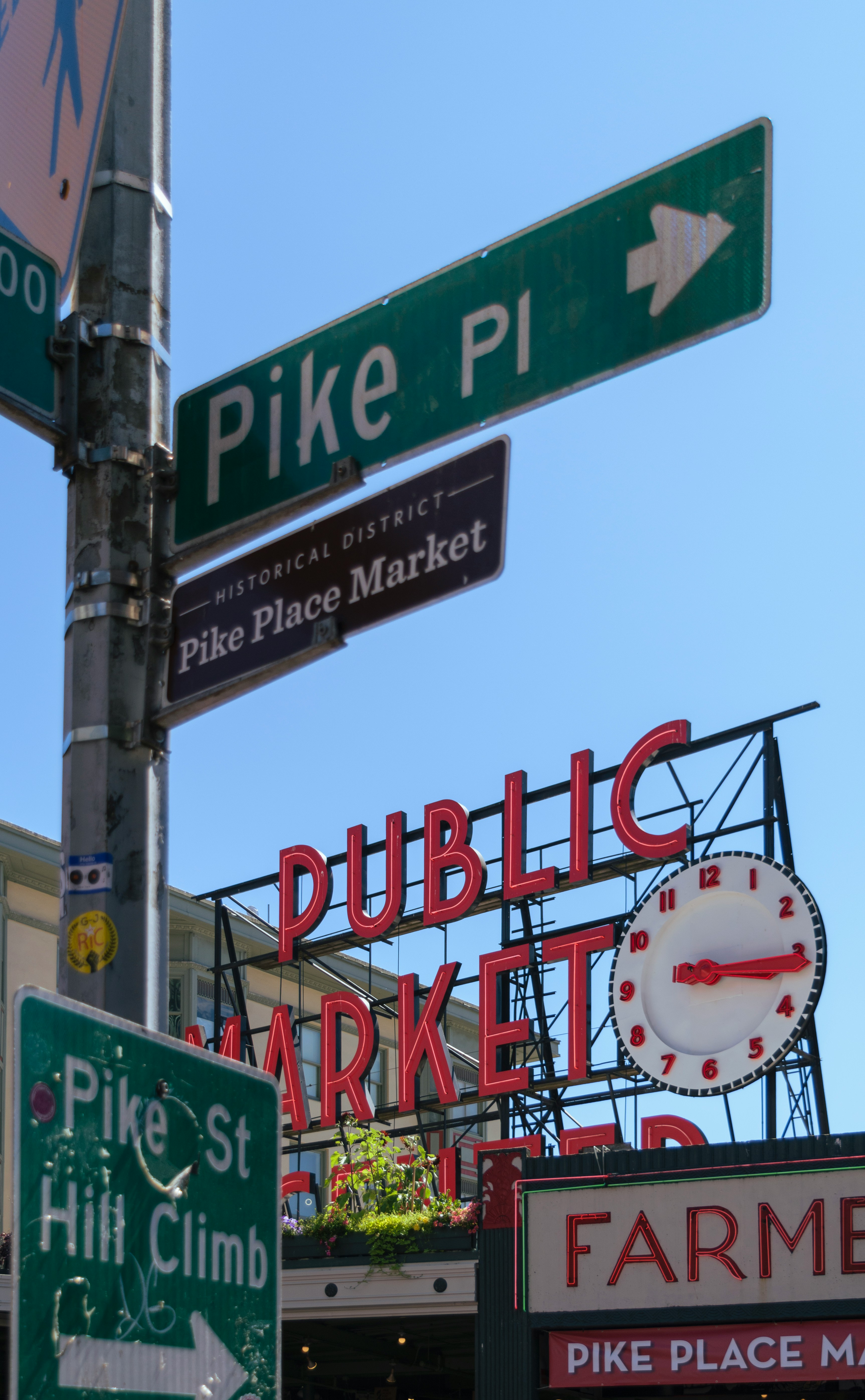 Pike Place Market entrance sign with crowds of visitors