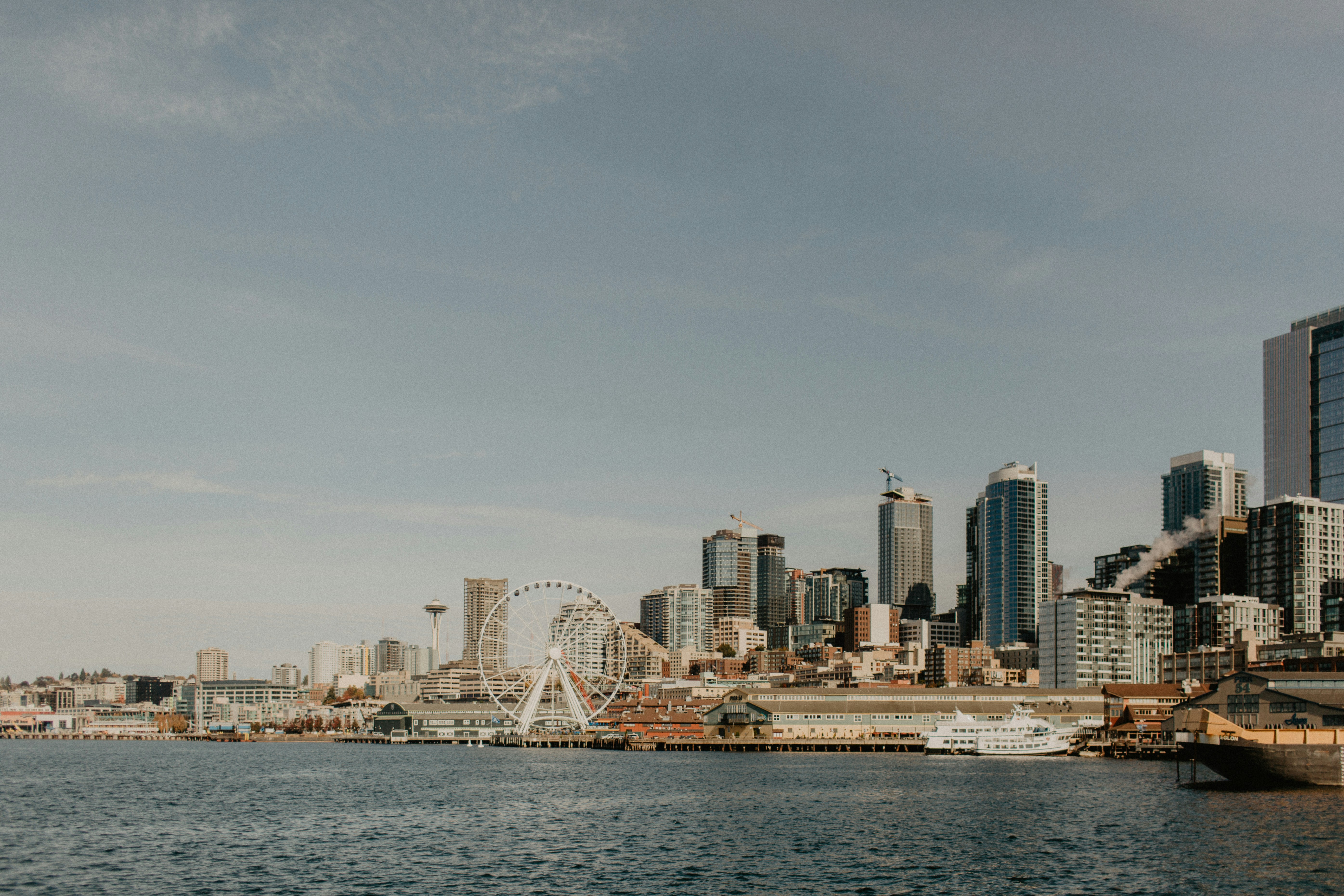 Seattle waterfront with ferries and the Olympic Mountains in the background